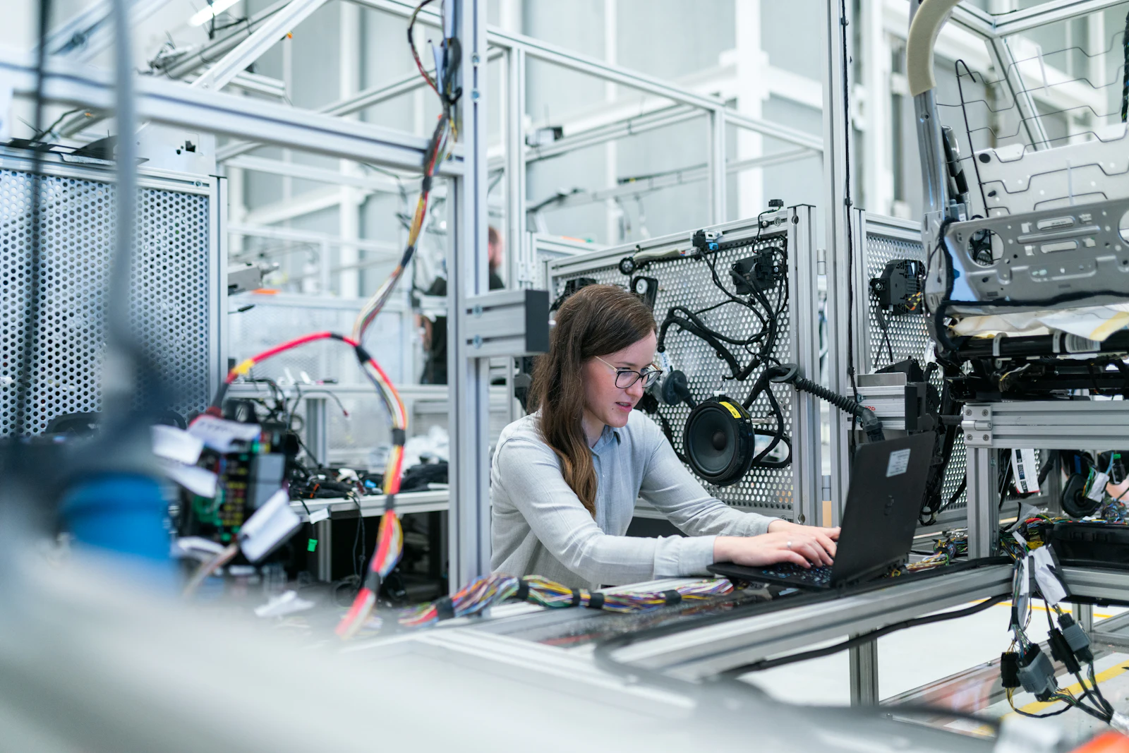 Engineer reviewing material behaviour on a production line