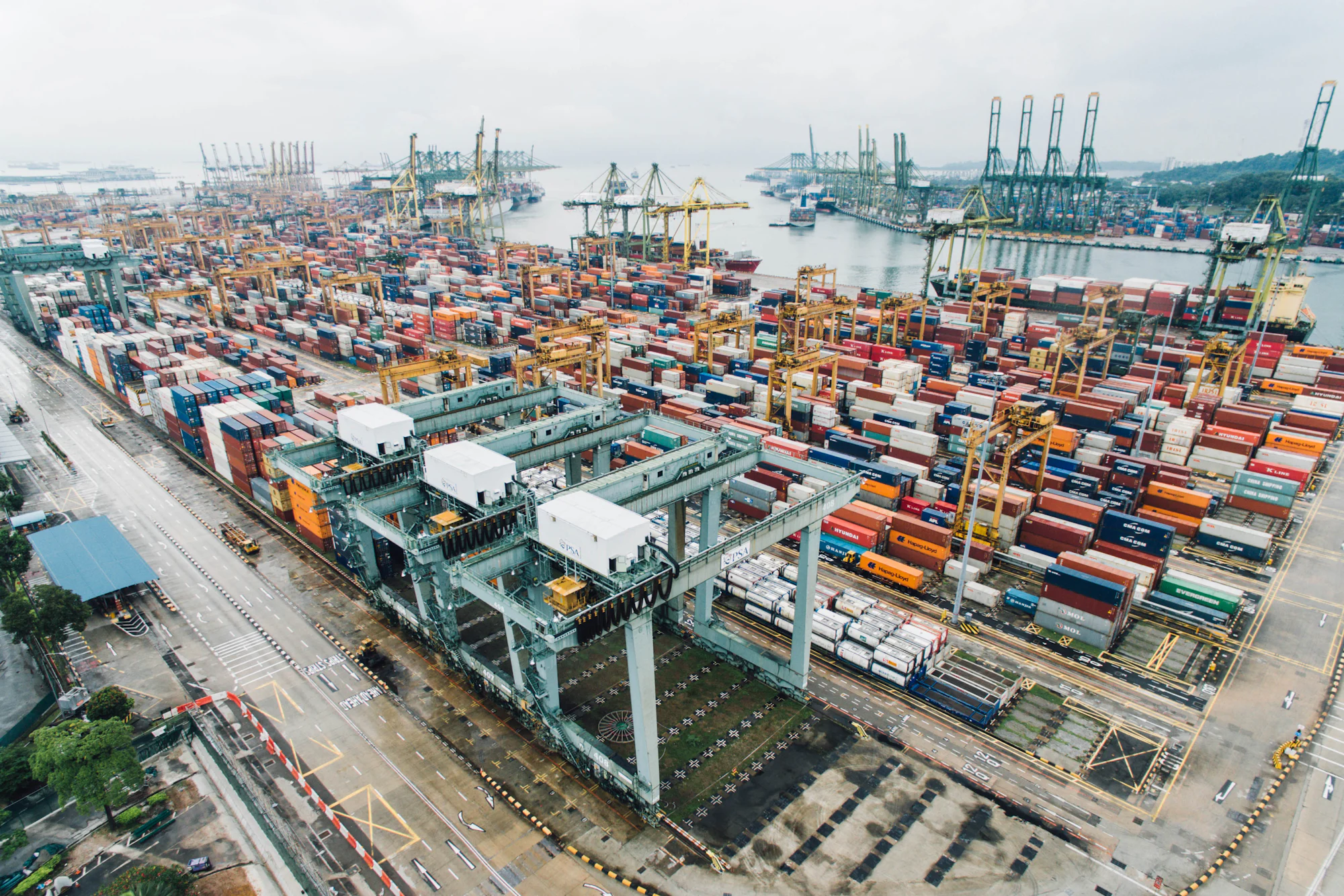 Container port seen from above, cargo moving through a global trade hub